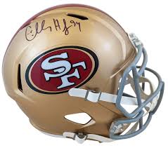Example of a gold 49ers helmet signed by Charles Haley